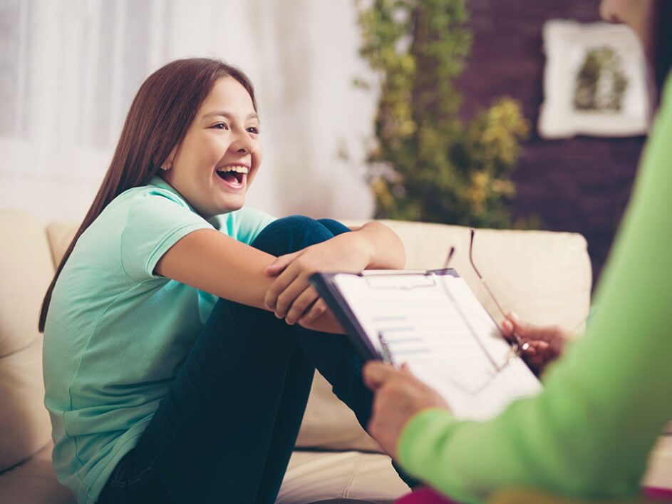 Teenager smiling during a meeting with a healthcare professional