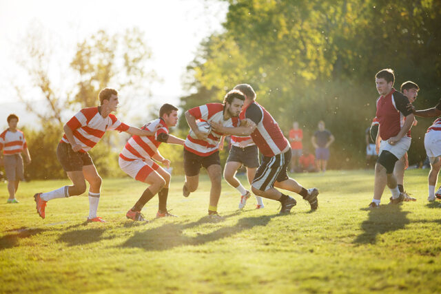 Rugby team tackling during scrimmage