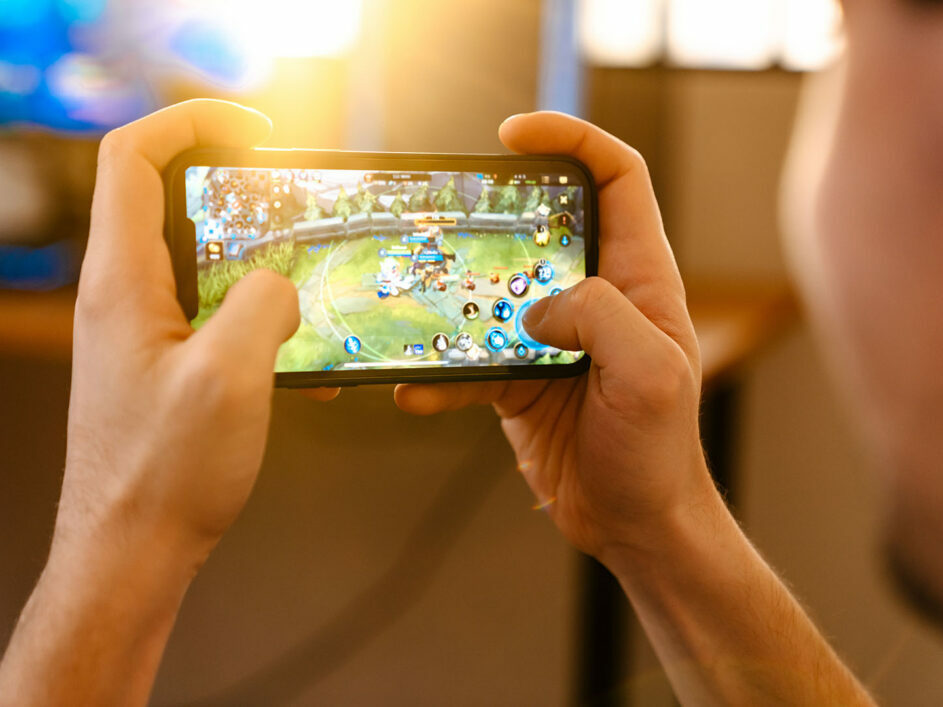 Young person gaming on a mobile phone