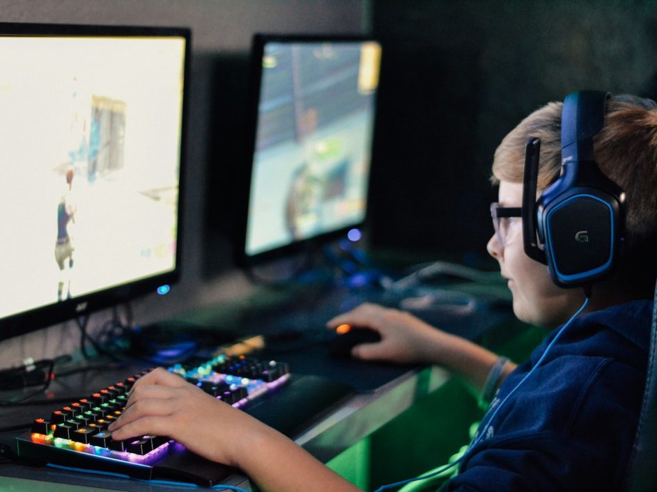 Young person playing video game at an esports event