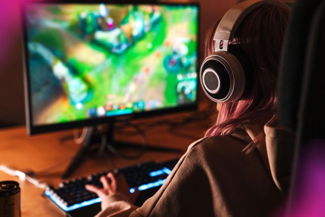 girl playing video game on desktop