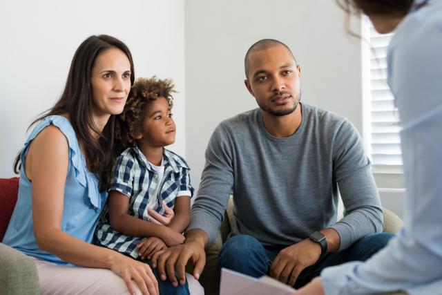 Adoptive parents speaking to an adoption support worker